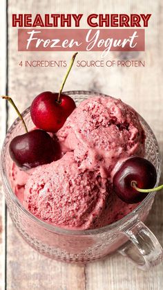 healthy cherry frozen yogurt in a glass bowl with two cherries on top