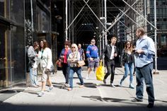 a group of people walking down the street