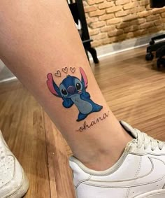 a tattoo on the leg of a woman with an stitching stitch stitch stitch stitch stitch stitch