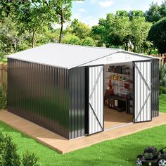 a small metal shed with the doors open and shelves on the outside, next to a lawn mower