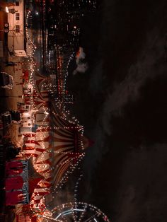 an aerial view of a carnival at night