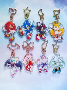 the sonic characters are all different colors and sizes on this keychain, which is also available for purchase