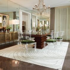 a dining room table with chairs and a chandelier