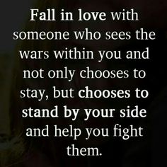 a couple kissing with the words fall in love with someone who sees the wars within you and not only chooses to stay, but choose to stand by your side