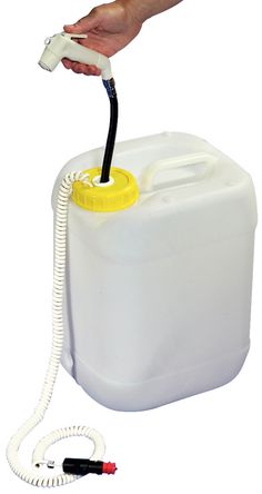 a hand is holding a white jug with a black hose connected to it and a yellow cap on the top