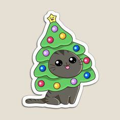 a black cat sitting next to a green christmas tree with lights on it's head