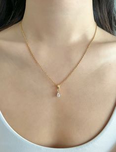 Our dainty link chain necklaces are made of stainless steel and plated with 18k gold. Not only is stainless steel hypoallergenic, but it's also highly durable, water-resistant, and tarnish-resistant! DETAILS ------------ - 18k Gold Plated Stainless Steel Chain, Lobster Clasp, 17in + 2in extender - Pendant: 18k Gold Plated, Cubic Zirconia, 8.5 x 5.5 x 3.5mm - Polishing cloth and vegan leather button pouch included PACKAGING & GIFTING -------------------------------- - All Stone & Sonder pieces co Trending Chains For Women, Teardrop Pendant Necklace, Gold Cubic Zirconia Drop Necklace Gift, Elegant Gold Teardrop Pendant Jewelry, Elegant Gold Plated Teardrop Necklace, Elegant Yellow Gold Drop Necklace For Anniversary, Elegant Pear-shaped Necklace For Gift, Gold Plated Teardrop Pendant Jewelry For Wedding, Gold Plated Teardrop Pendant For Wedding