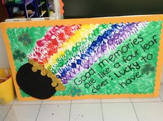 a child's hand painted sign with a hat and rainbow