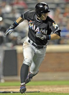 a baseball player is running on the field