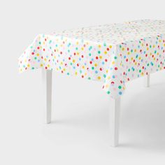 a white table with multicolored dots on it