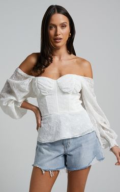 The Ybur Top is the perfect party piece that will make heads turn! With a flirty off-shoulder design, long sleeves and bustier neckline in dreamy ivory, this fashion top will have you feeling confident and stylish all night long. Made to elevate any outfit, whether you pair it with jeans or a cute skirt - get ready for compliments galore! So go ahead girl, show off those shoulders in style with our Ybur Top. Elegant Summer Long Sleeve Off-shoulder Top, Spring Party Long Sleeve Off-shoulder Top, Elegant Long Sleeve Off-shoulder Top For Summer, Chic Long Sleeve Corset For Party, Evening Tops With Boned Bodice For Spring, Elegant Off-shoulder Top For Spring Day Out, Elegant Off-shoulder Top For Day Out In Spring, Trendy Fitted Off-shoulder Top For Party, Elegant Spring Tube Top For Brunch