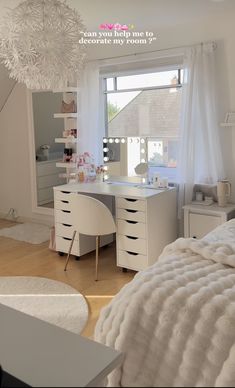 a bedroom with white furniture and a large window