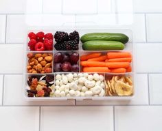 a plastic container filled with fruits and vegetables