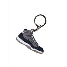 an air jordan shoe keychain is shown on a white background and has a black bottom