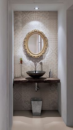 a bathroom with a sink and mirror in it