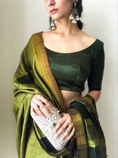 Handwoven tussar silk paired with silver earrings and silver hand clutch. #tussarsilksaree #tussarsilk #greensaree #saree #aesthetic #silverjewelleryindian #silverjewelleryindianantique #silverjewellery #silver #silverhandclutch #silverearring #sunkissed #sunkissedddreams #indianfashion #indianwear #indianbride #sangeetoutfit Sari Ideas, Saree Aesthetic, Hand Clutch, Sangeet Outfit, Silver Jewellery Indian, Green Saree, Tussar Silk Saree, Profile On Instagram, Silver Jewellery