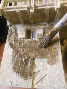 a close up of a building with a broom sticking out of it