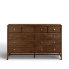 the chest of drawers is made from wood and has brass knobs on each drawer