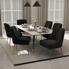 a dining room table with black chairs and a rug on the floor in front of it