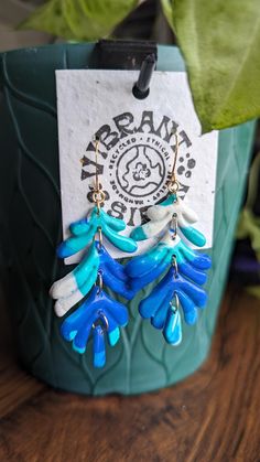 Blue Earrings made from upcycled plastic that would otherwise pollute our oceans or end up in landfills. Locally collected plastic from communities in San Diego, California.  Washed and sanitized, hand melted and molded into statement jewelry.   All metals are sourced from other local small businesses.  Earring cards are made from native California Wildflower seed paper.  All packaging material is also recyclable or compostable.   These earrings are very lightweight and hypo-allergenic.  Great for people with sensitive ears!  These are the perfect gift for any occasion or if you want to help to bring awareness to plastic pollution. Hot Glue Art, Beer Can Holder, Wildflower Seed Paper, Jewelry Recycled, Glue Art, Plastic Earrings, Seed Paper, Plastic Pollution, Plastic Jewelry