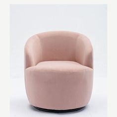 a pink chair sitting on top of a white floor next to a black round object