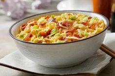 a white bowl filled with food on top of a table