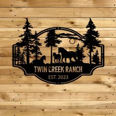 two horses in the woods personalized with name and date on wood paneled wall