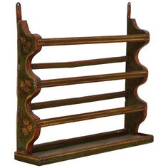 an old wooden shelf with three shelves on it