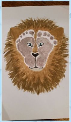 a drawing of a lion's head with blue eyes and brown fur on it