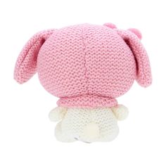 a pink knitted animal with a white face and ears on it's head