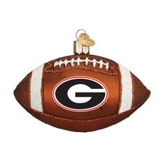 a football ornament with the letter g on it