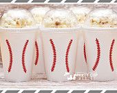 three popcorn cups with baseball stitches on them