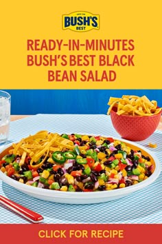 a large plate of food sitting on top of a table next to a glass of water