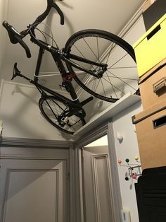 there is a bike hanging from the ceiling