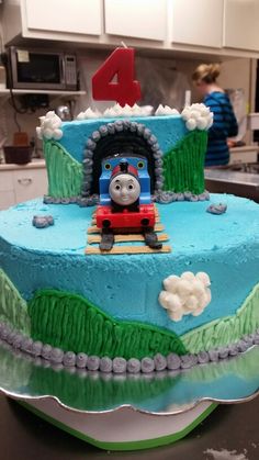 a thomas the train birthday cake on a table