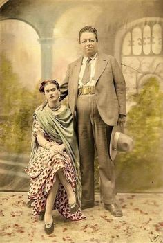 an old photograph of a man and woman