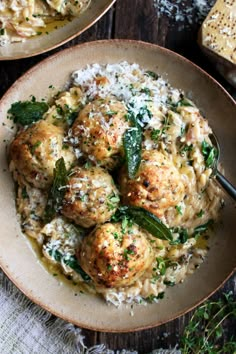 two plates filled with meatballs and rice on top of a table next to bread