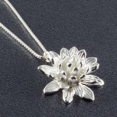 "Sterling Silver Lotus Flower Pendant Necklace, Mothers Day Jewelry Gift, Anniversary Necklace, Botanical Blossom Nature Charm, FREE SHIPPING Why is the beautiful lotus flower a symbol of rebirth, recovery, and spiritual renewal? Because for centuries cultures have admired how the lotus flower can survive, awakening each day from muddy and undesirable waters. Many see this as an analogy of life and the human ability to find strength by overcoming daily struggles. Some also believe the lotus flow Lotus Flower Pendant, Mothers Day Jewelry, Lotus Necklace, Anniversary Necklace, Cheap Necklaces, Silver Gift Box, Flower Pendant Necklace, Dream Jewelry, Pretty Jewellery