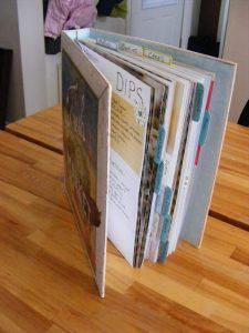 an open book sitting on top of a wooden table