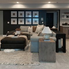 a living room filled with furniture and pictures on the wall