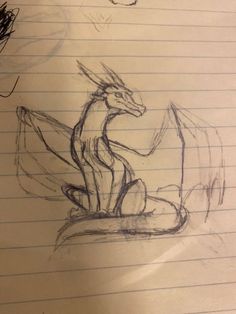 a pencil drawing of a dragon sitting on top of a piece of paper with writing underneath it