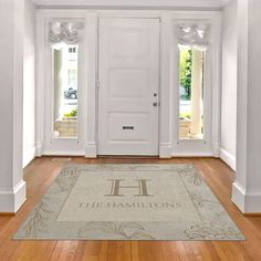 a white door with a welcome mat in front of it