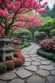 a stone path surrounded by pink flowers and trees