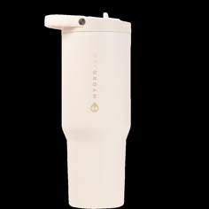 the tumbler cup is white and has a handle on it's side, with an insulated lid