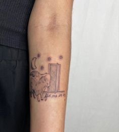 a tattoo on the arm of a man with an open door and stars in the sky