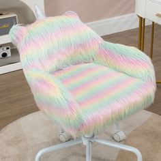 a pastel colored chair sitting on top of a rug