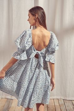 This must-have baby doll mini dress is the perfect combination of beauty and sweetness, embroidered with a gingham floral pattern. It features a square neckline, puffy 3/4 length sleeves with ruffled cuffs, and an open back with a self-tie bow. This gingham dress is sure to be the perfect addition to any picnic, spring and summer or everyday outfit. Material:Cotton Final sale item. Cannot be canceled or returned. Gingham Dress Outfit, Babydoll Dress Outfit, Picnic Spring, Blue White Fabric, Gingham Outfit, Blue Gingham Dress, Dress With Puffy Sleeves, Picnic Dress, Blue Gingham