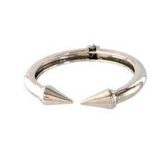 Our designer inspired Spike Tip Silver Hinged Open Bracelet is open at the front, and features cone spiked tips. Silver plated metal. Hinge closure. Wear it alone or stacked with your favorite bracelets. The perfect arm candy!DETAILS: Hinged bracelet Open front Silver plated metal Diameter: 2.5 inches; Inner circumference: approx. 7 inches Open Bracelet, Hand Rings, German Silver Jewelry, Silver Diamond Necklace, Hinged Bracelet, Dream Ring, Arm Candy, Silver Hoop Earrings, Cuff Bracelet