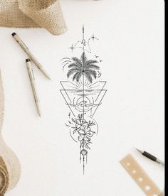 a drawing of a palm tree on top of a white paper next to some pencils