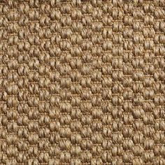 a close up view of the texture of a woven material with brown and tan colors